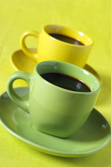 Yellow and green cups of coffee