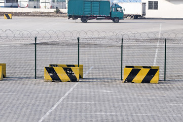 Metal fence and Restricted Area Sign at the airport cargo area