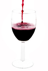 A clear glass of red wine isolated on a white background