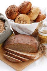 Heap of various bread, bag with wheat and macaroni