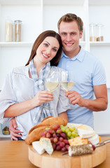Obraz na płótnie Canvas Happy couple drinking white wine