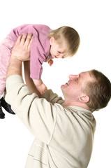 Father tossing up a child