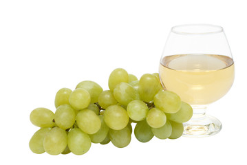 glass of wine and a bunch of grapes on a white background