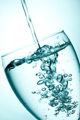 water splashing  into glass