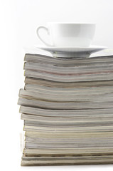 Magazines and coffee cup
