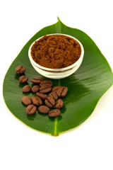 Coffee: whole beans and ground on leaf