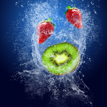 Water Drops Around Fruits On Blue Background