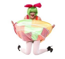 A portrait of a clown girl in fancy dress, wig and bow