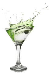 Green alcohol cocktail with splash isolated on white