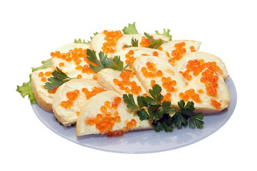 Sandwich with red caviar on the plate on the white