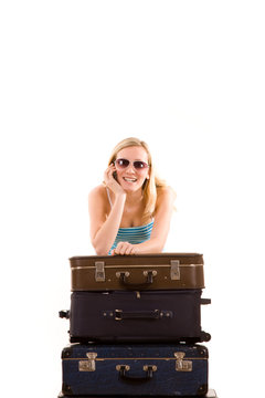Girl leaning on suitcases