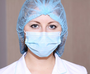 Closeup portrait of a young doctor wearing a mask