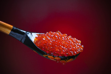 red caviar on spoon