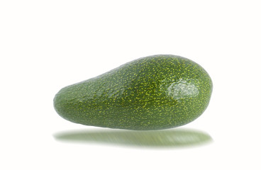 Green avocado on the white.