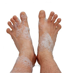 Male foots in bath foam - 20989276