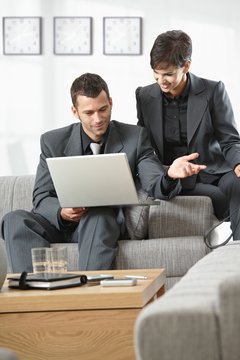 Businesspeople working on computer