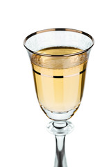 isolated section of wineglass with white wine