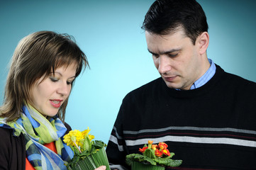 white couple choosing flowers for gifts