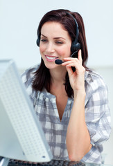 Caucasian smiling businesswoman with headset on