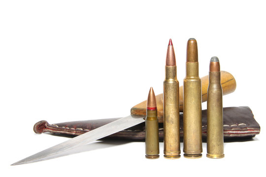 4 different caliber rifle cartridges and hunting knife