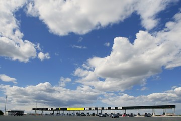 Obraz premium Toll motorway road in Europe in a sunny blue day with clouds