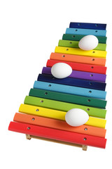 colourful xylophone and white eggs