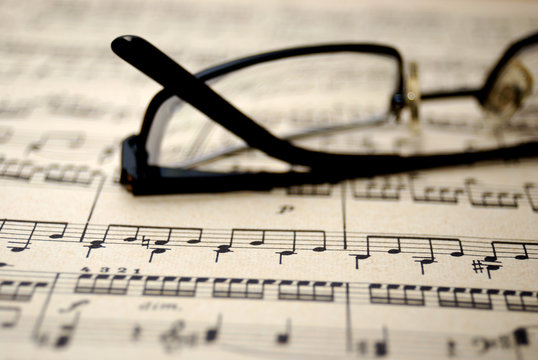 Old music sheet and glasses.