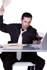 Upset Businessman at His Desk in Suit