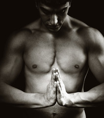 Spiritual concentration - muscular man doing yoga