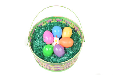 Easter basket with colored eggs and hen