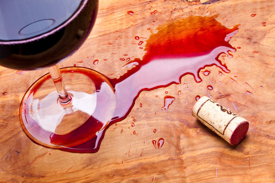Spilled wine on a olive wood table