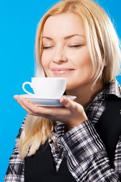 Young Beautiful Woman Smelling Coffee