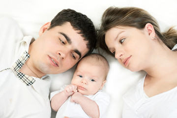 happy family - mother, father and baby
