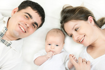 happy family - mother, father and baby