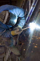 The welder behind work