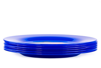 Six dark blue plates on a white