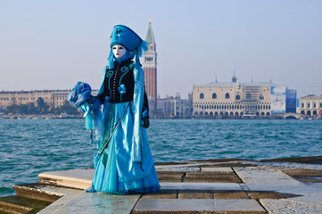 beautiful blue mask on quay at the carnival in Venice