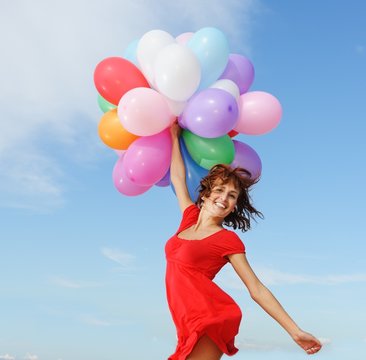 Happy girl with balloons
