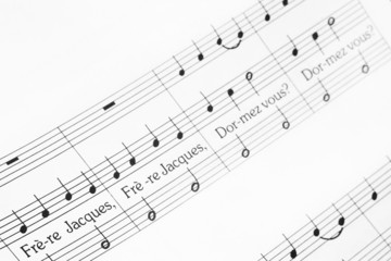 musical notes of melody Frère Jacques with selective focus