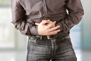 Man suffering for stomach ache.