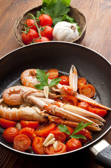 scampi with tomatoes in casserole