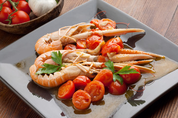 dish with scampi and tomatoes