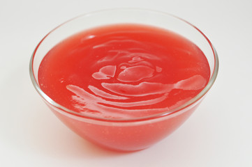 Crimson jelly in a vase.