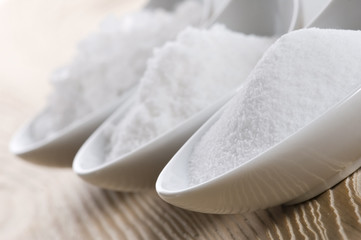 three spoons with difrent salt