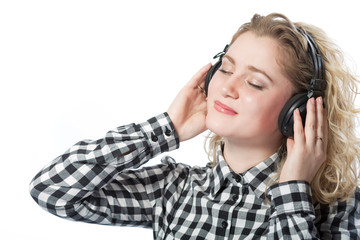 blond caucasian girl in headphones listening to music isolated