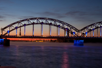 Blue railway bridge at sunrise