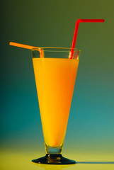 glass with drink on the yellow background