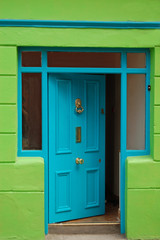 Obraz na płótnie Canvas open welcoming blue door