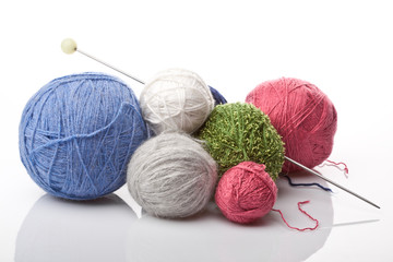colorful yarn balls on white