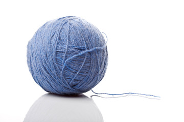 Ball of blue wool isolated on a white background